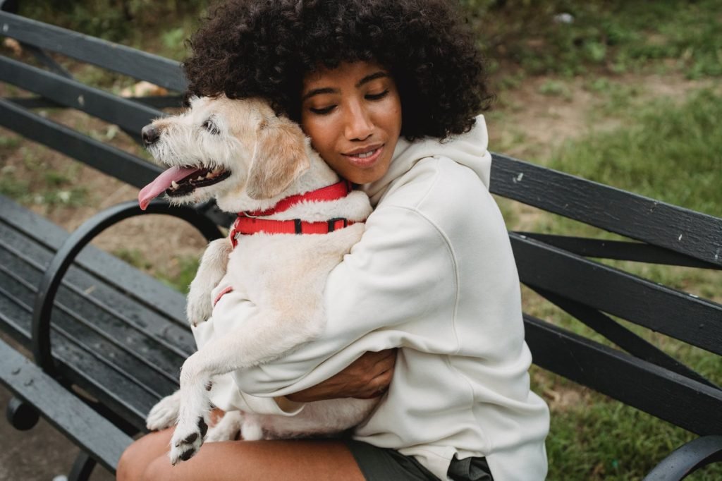 woman hugging her dog